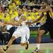 Michigan sophomore Trey Burke passes the ball around Iowa junior Melsahn Basabe in the second half at Crisler Center on Sunday, Jan. 6. Michigan beat Iowa 95-67 in the Big Ten home opener. Melanie Maxwell I AnnArbor.com